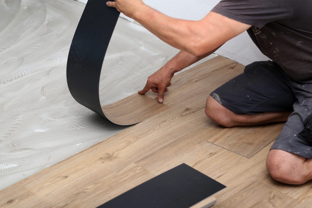 worker-installing-new-vinyl-tile-floor-1-1024×683
